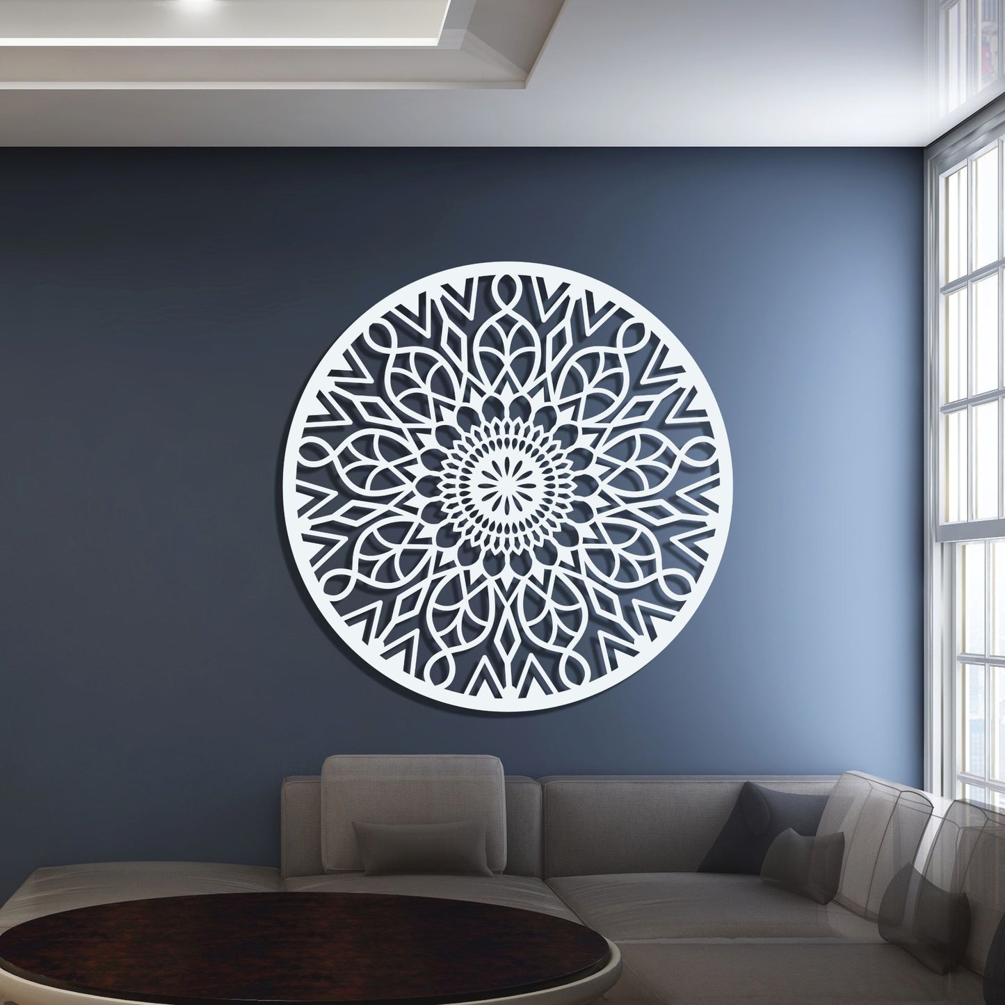 Decorative wall art with a geometric pattern on a blue wall in a living room.