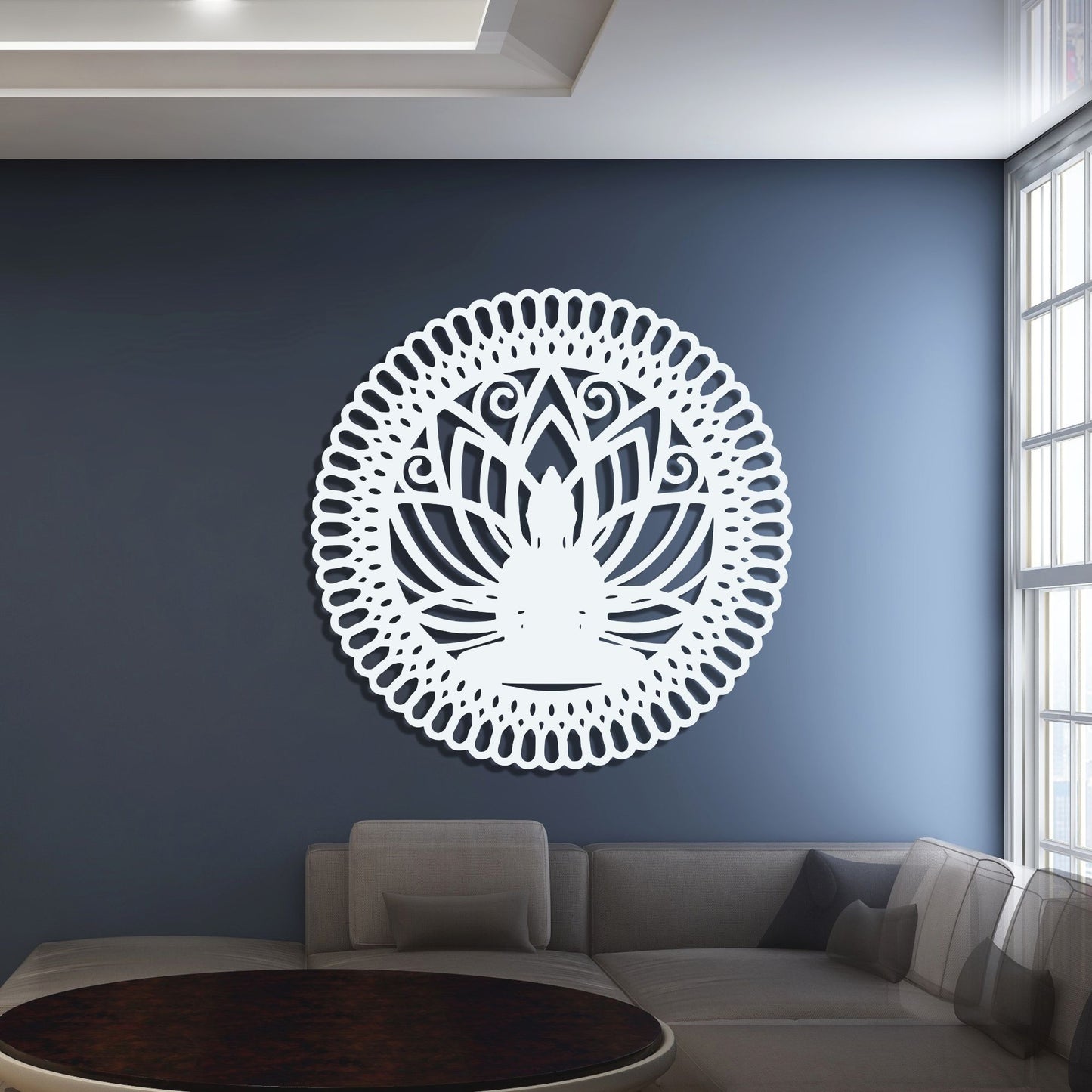 Decorative wall art with a white mandala design on a blue wall in a modern living room.