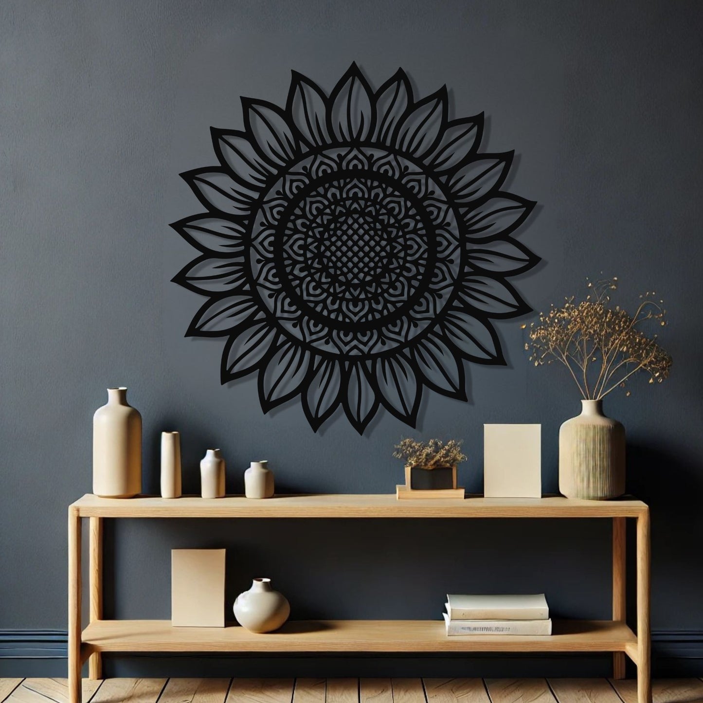Decorative black sunflower wall art on a dark gray wall with a wooden shelf below.
