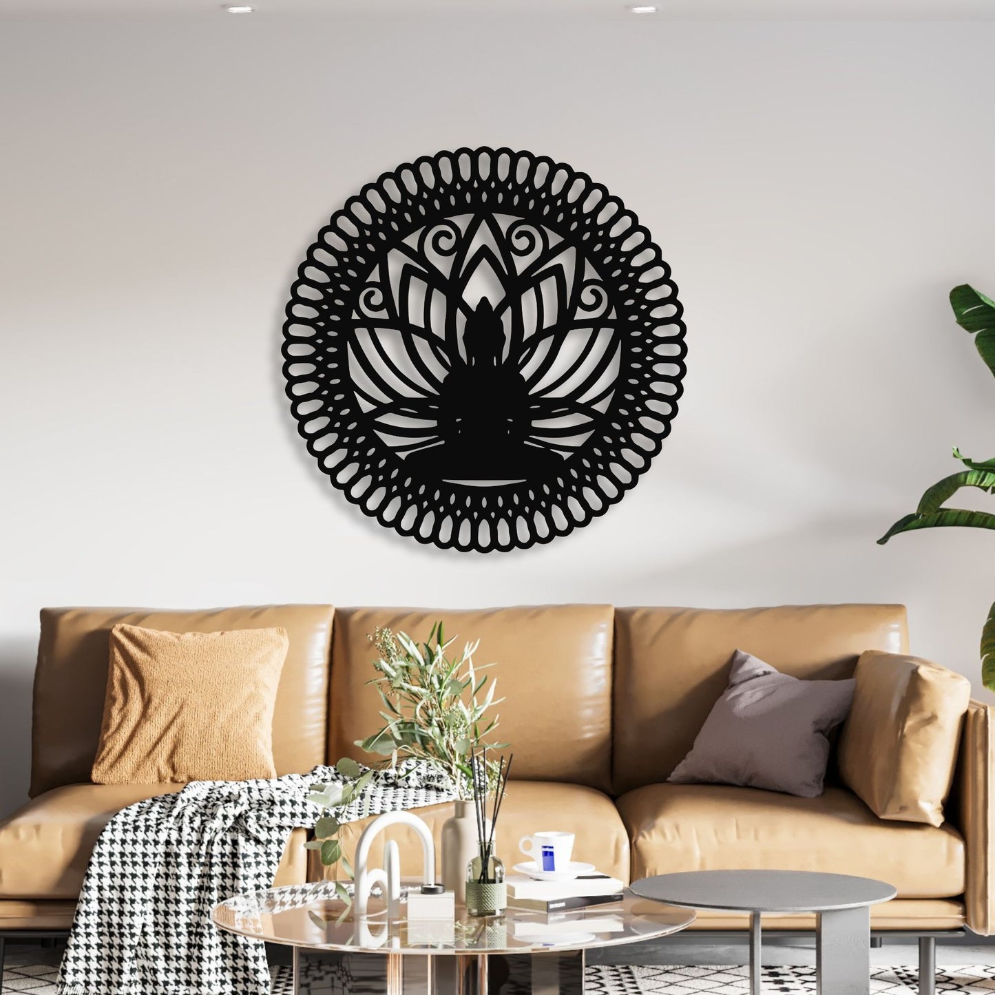 Decorative black wall art on a white wall above a brown sofa.