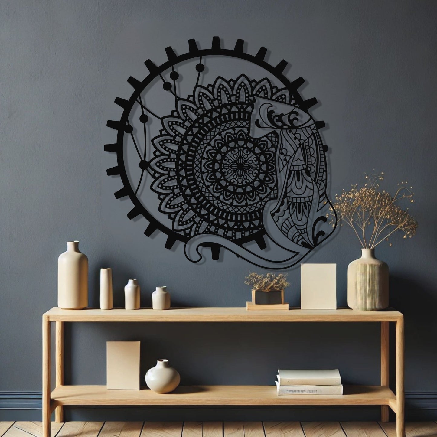 Decorative wall art with a mandala design on a dark gray wall above a wooden console table.