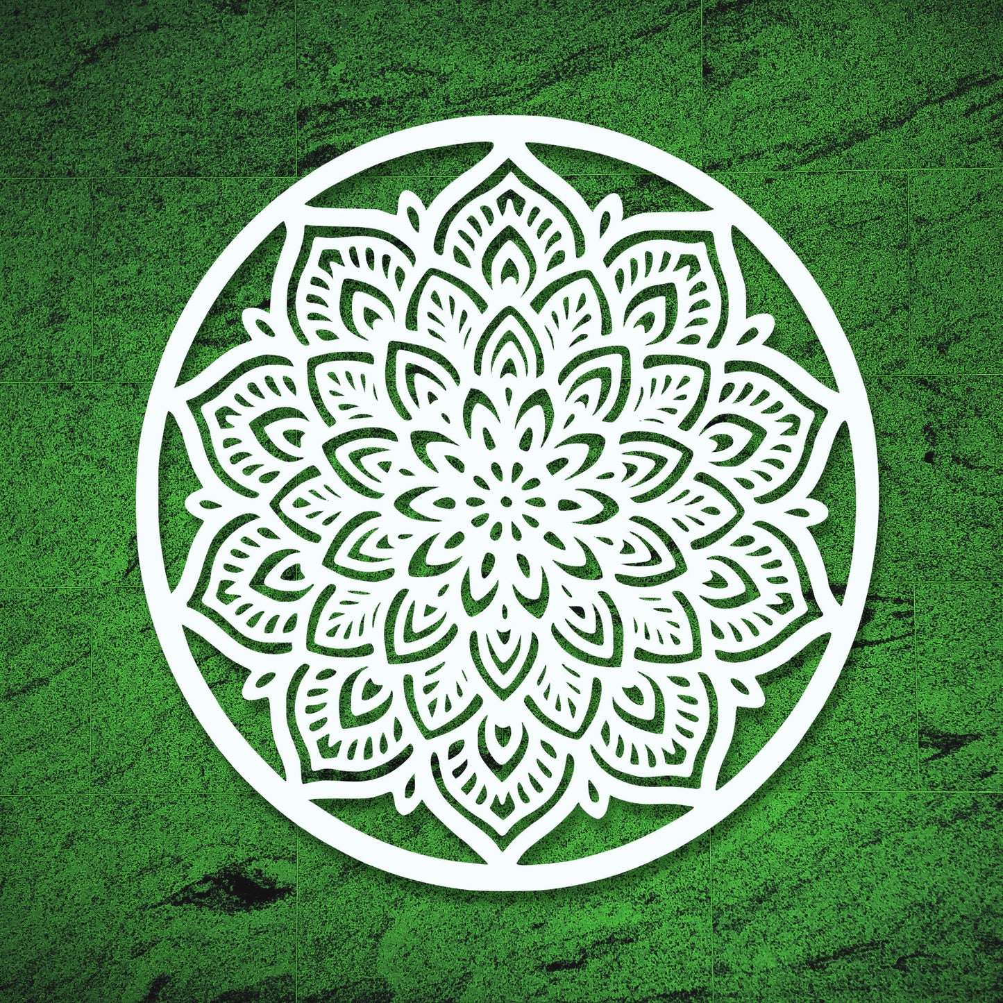 White mandala design on a green textured background