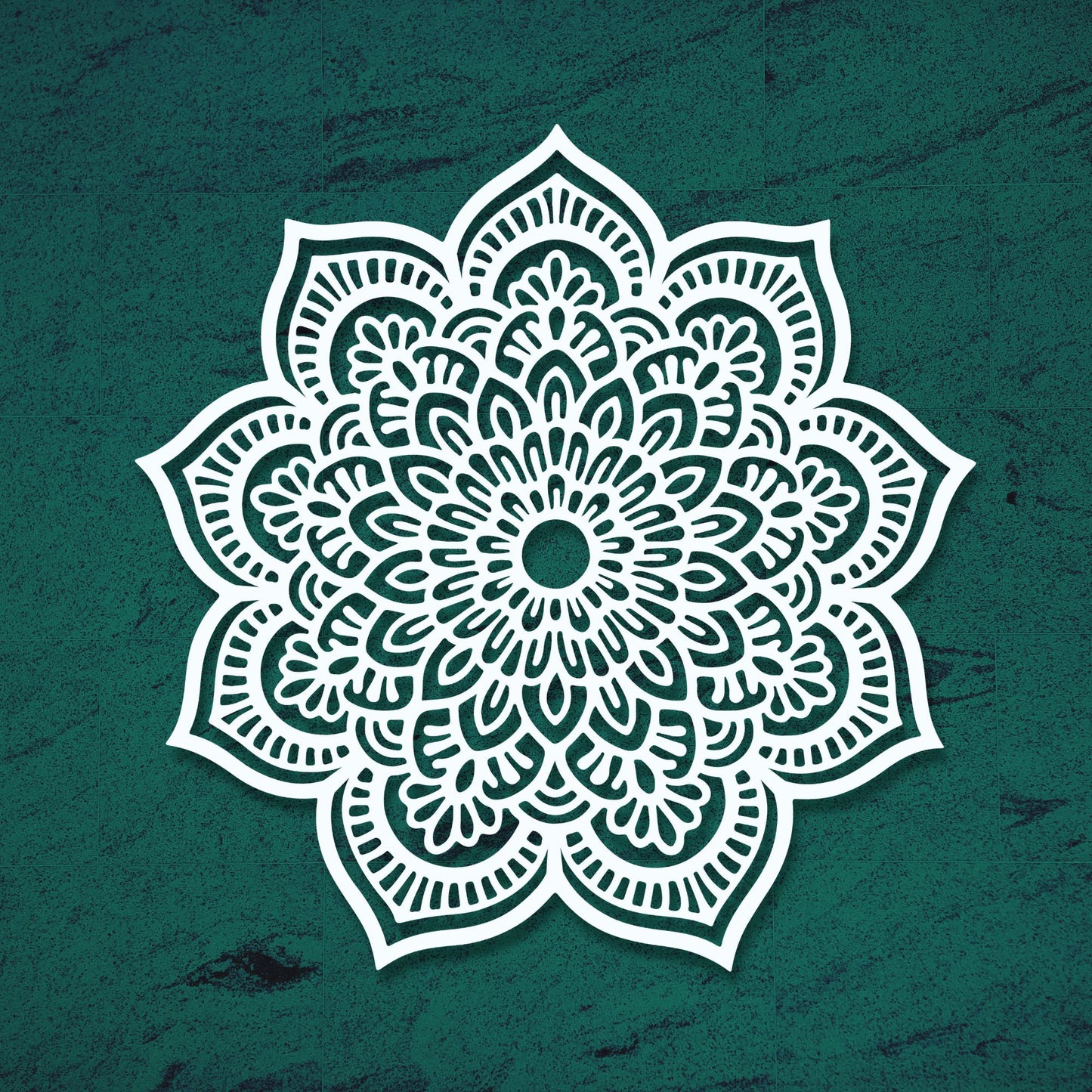 White mandala design on a teal textured background