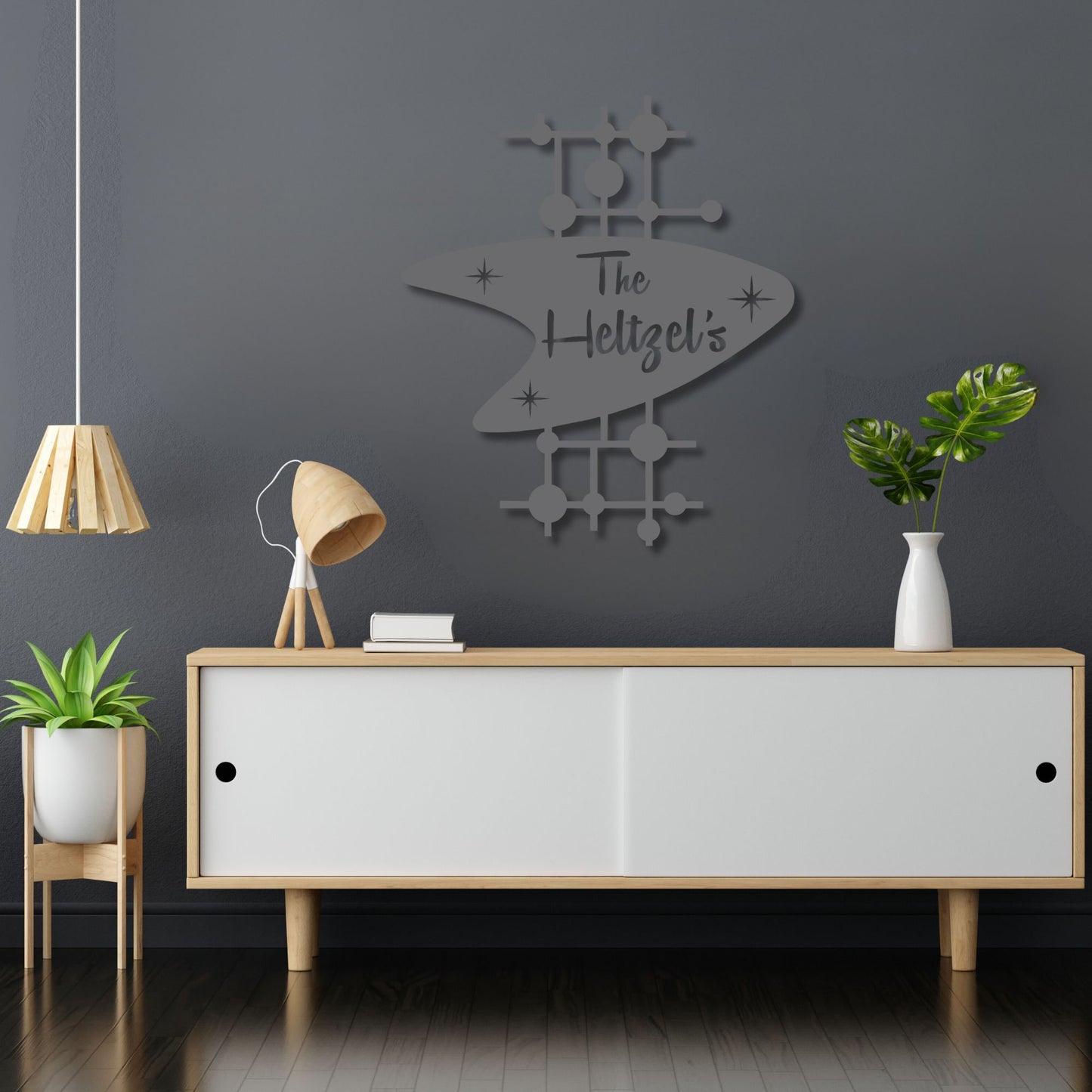 Modern interior with a gray wall, wooden sideboard, and decorative elements.