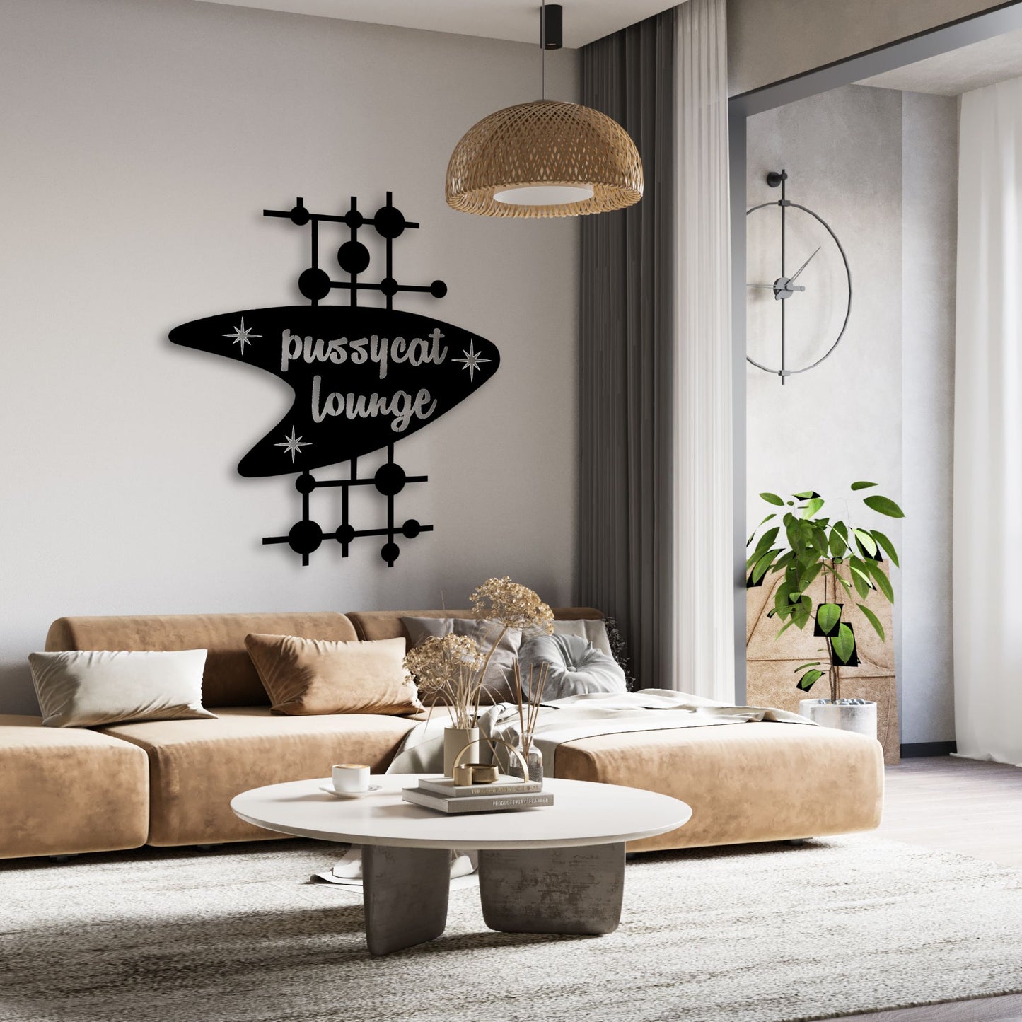 Modern living room with a 'pussycat lounge' wall decoration.