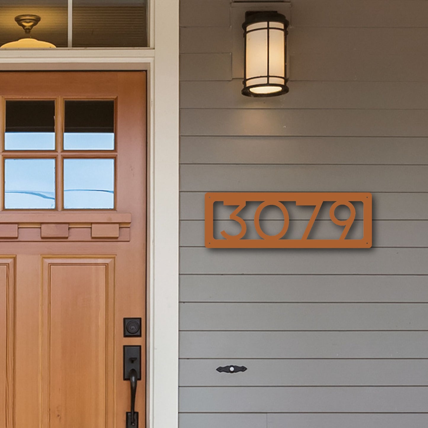 Horizontal Number Address Sign, Open Style shown in copper on inviting front porch