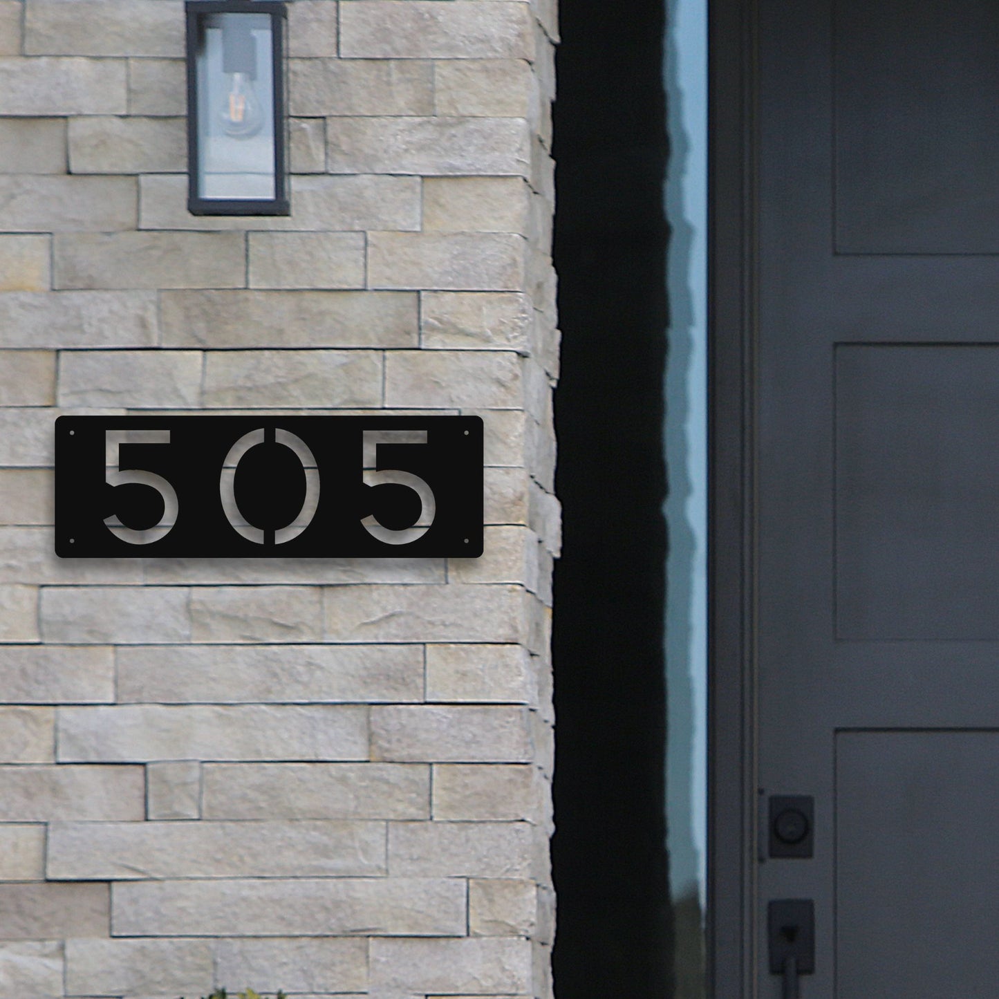 Horizontal Number Address Sign, Closed Style shown in black on modern front door step