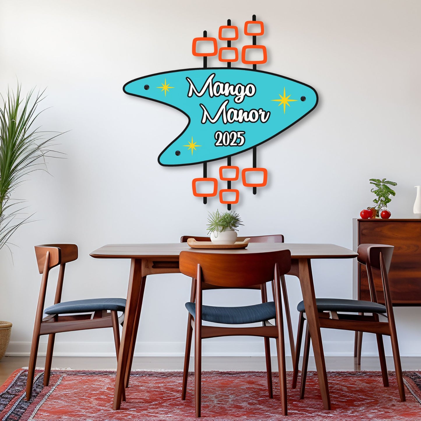 Personalized Retro Metal Sign hung over dining room table with Mango Manor and 2025 printed on it