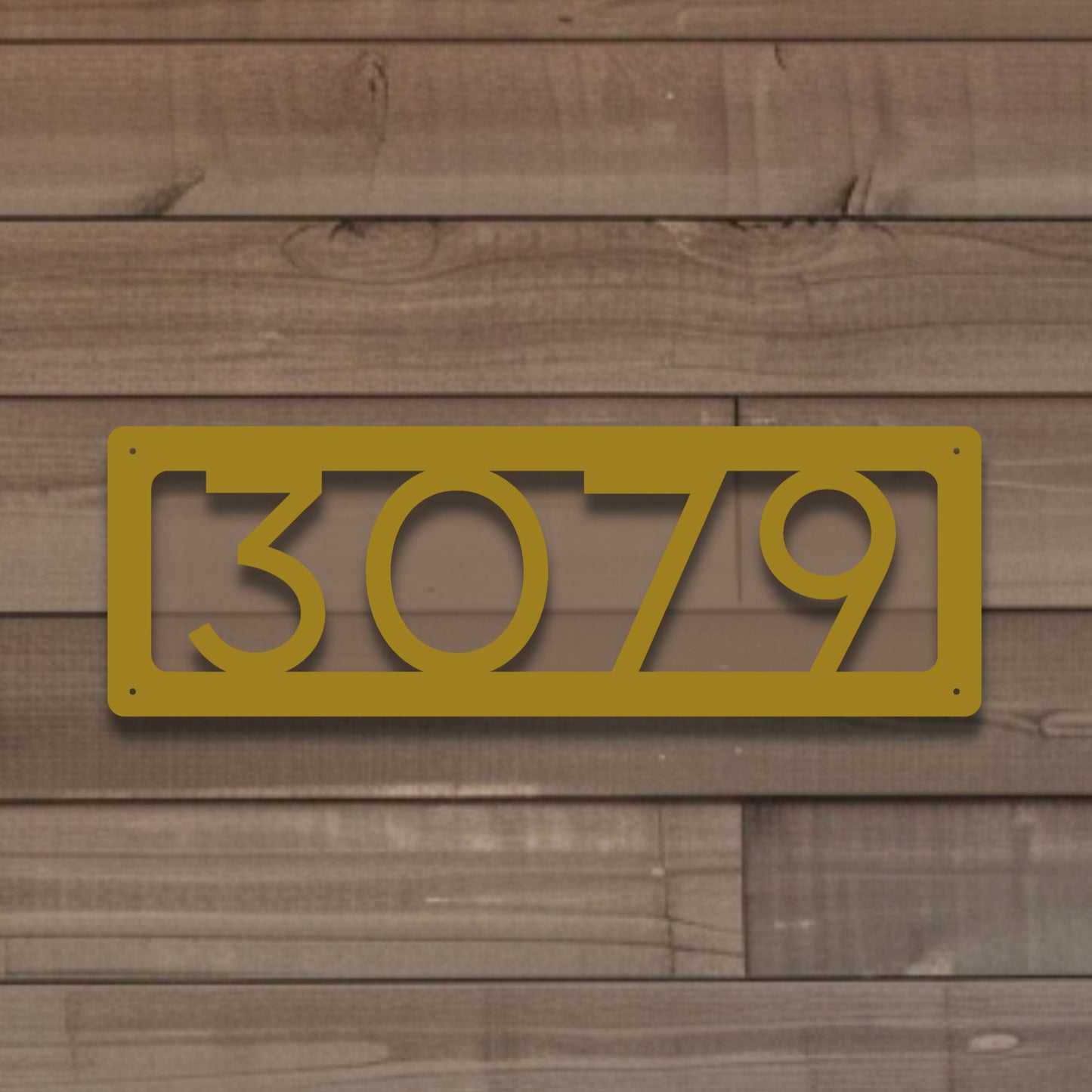 Horizontal Number Address Sign, Open Style shown in gold against brown natural wood siding