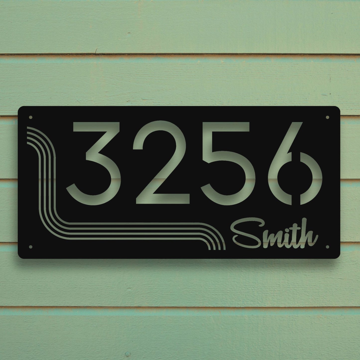 House number sign with '3256 Smith' on a green wooden background