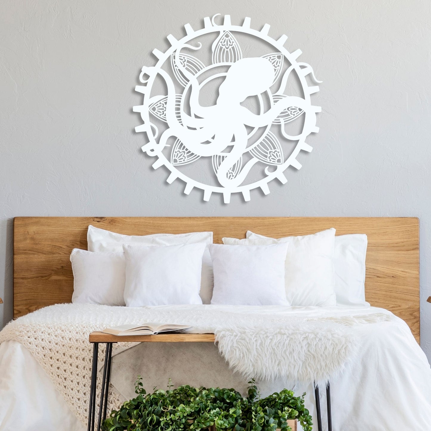 Decorative wall art above a bed with wooden headboard and white pillows.