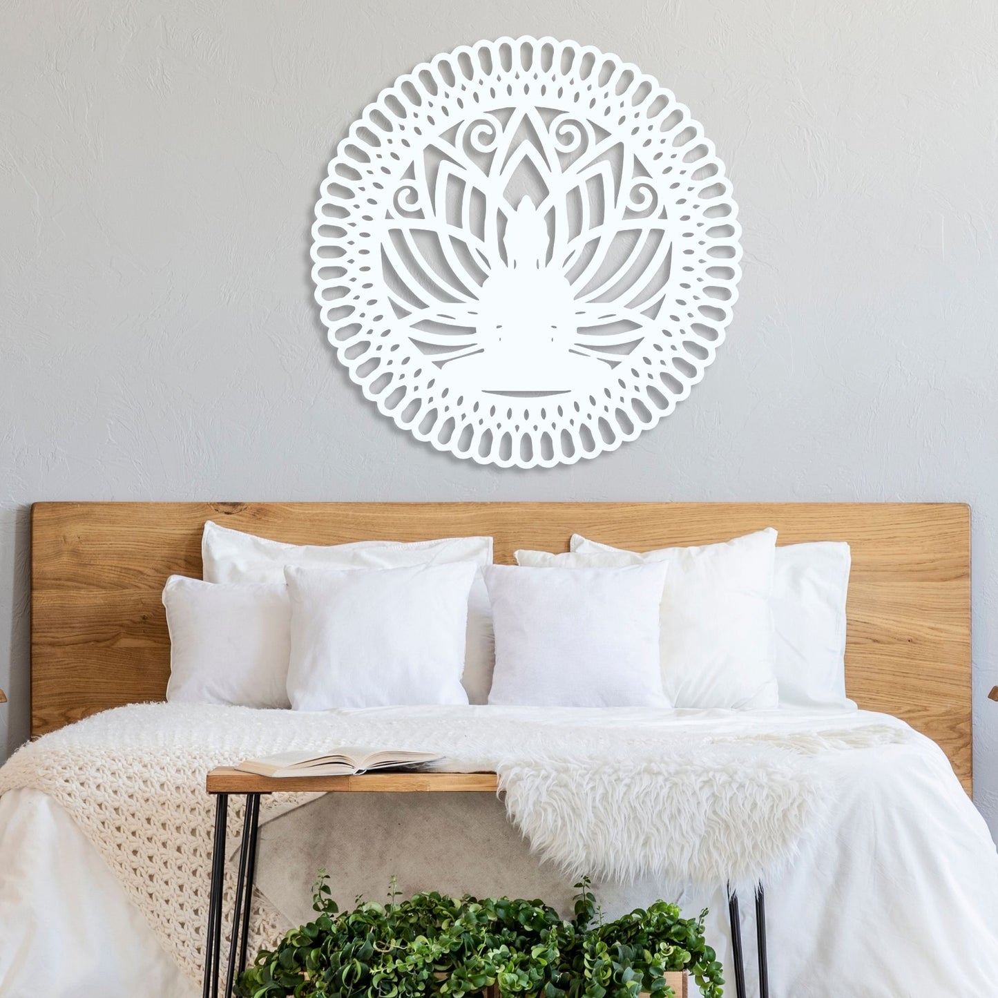 Decorative wall art above a bed with white bedding and wooden headboard.