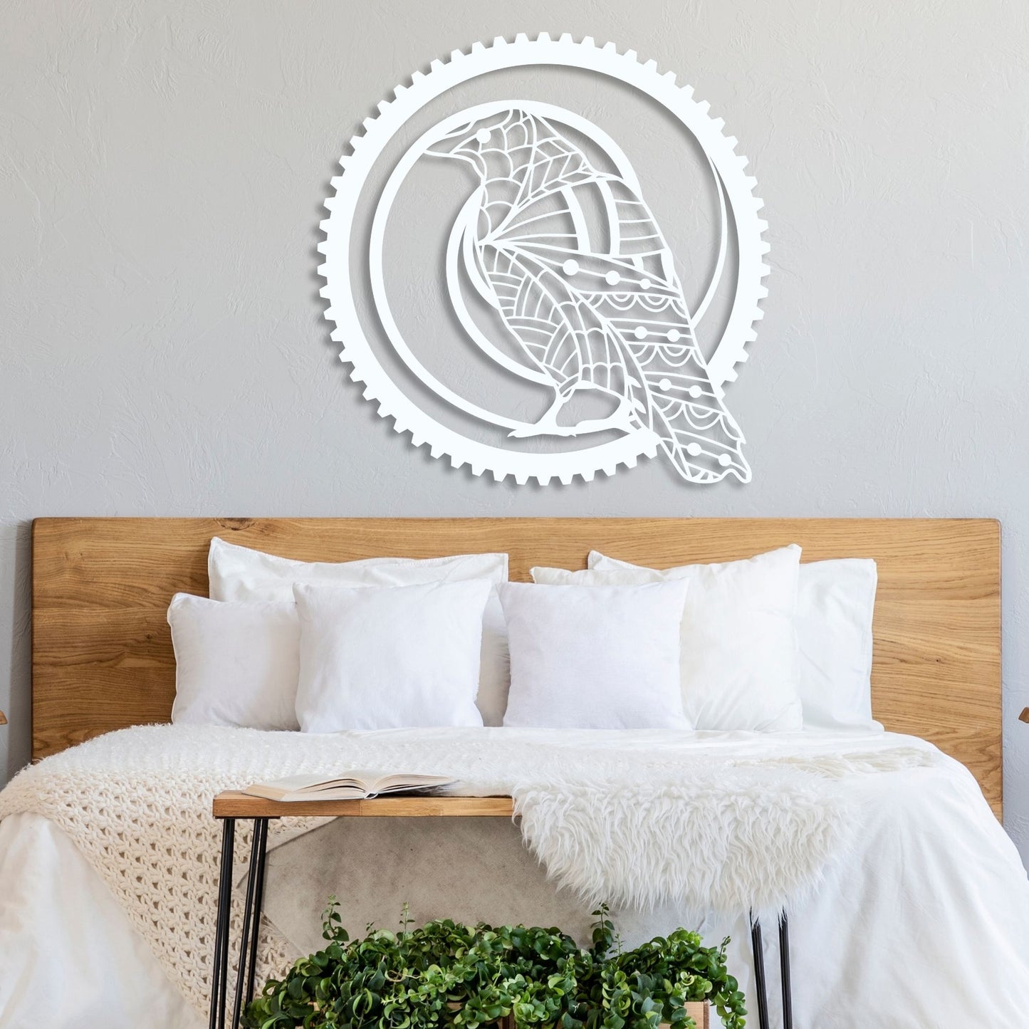 Decorative wall art above a bed with wooden headboard and white bedding.