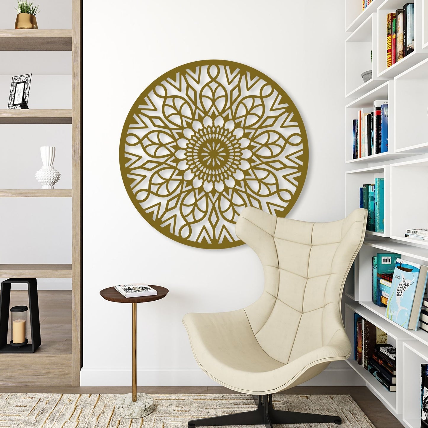 Decorative wall art with a mandala design in a room with a chair and bookshelves.