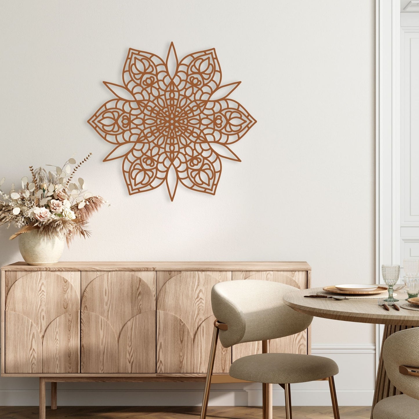 Decorative wall art above a wooden cabinet in a room with a table and chairs.