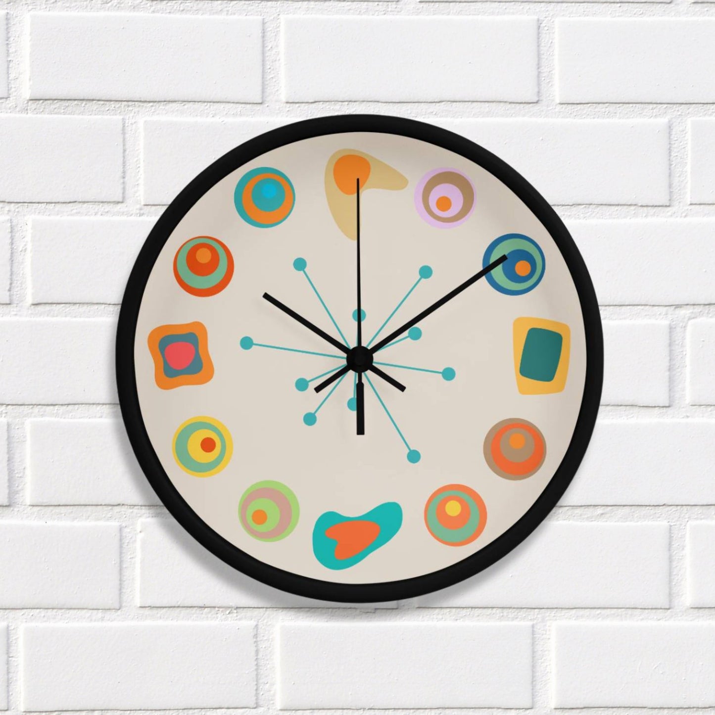 Colorful wall clock with abstract designs on a white brick wall