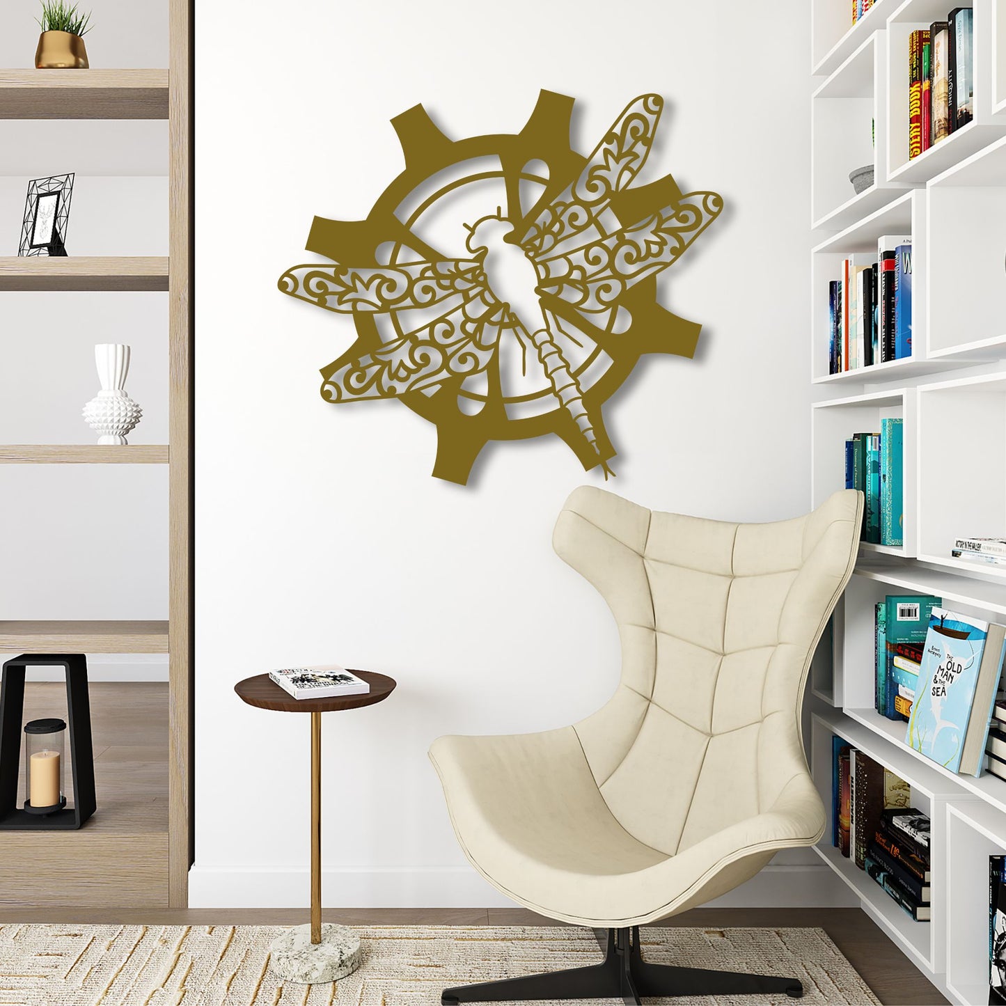 Decorative wall art with a dragonfly design on a white wall above a beige chair.