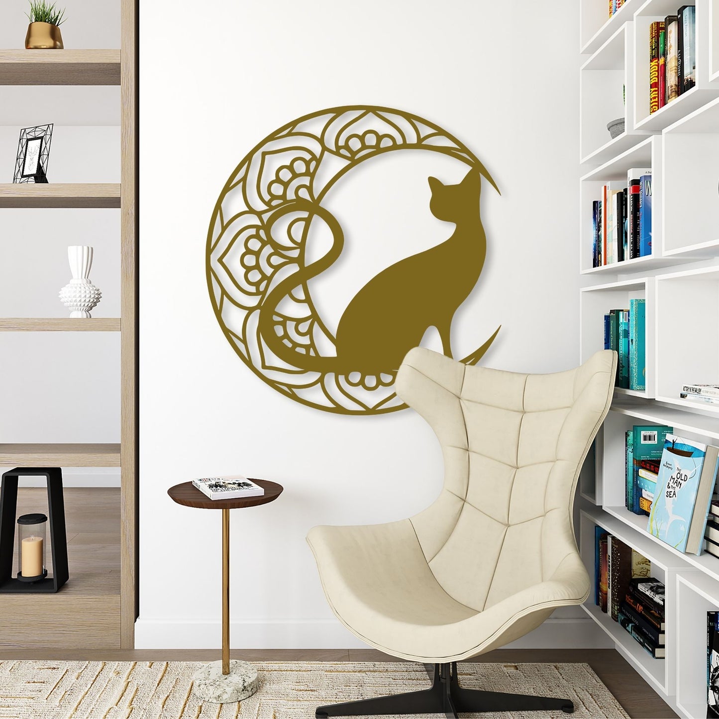 Decorative wall art of a cat in a circular design on a white wall above a beige chair.