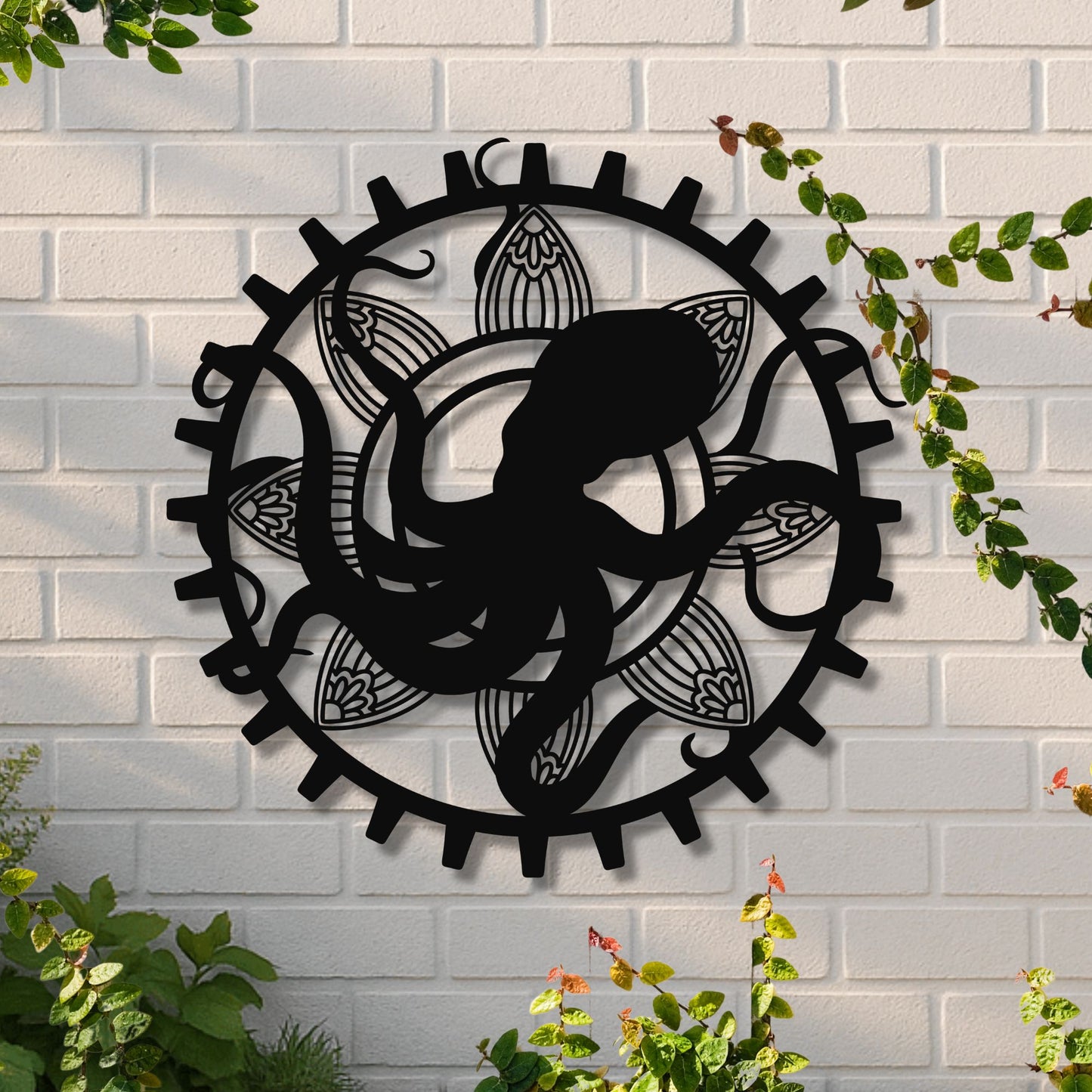 Decorative wall art with a black silhouette of a person climbing a mountain on a white brick wall.