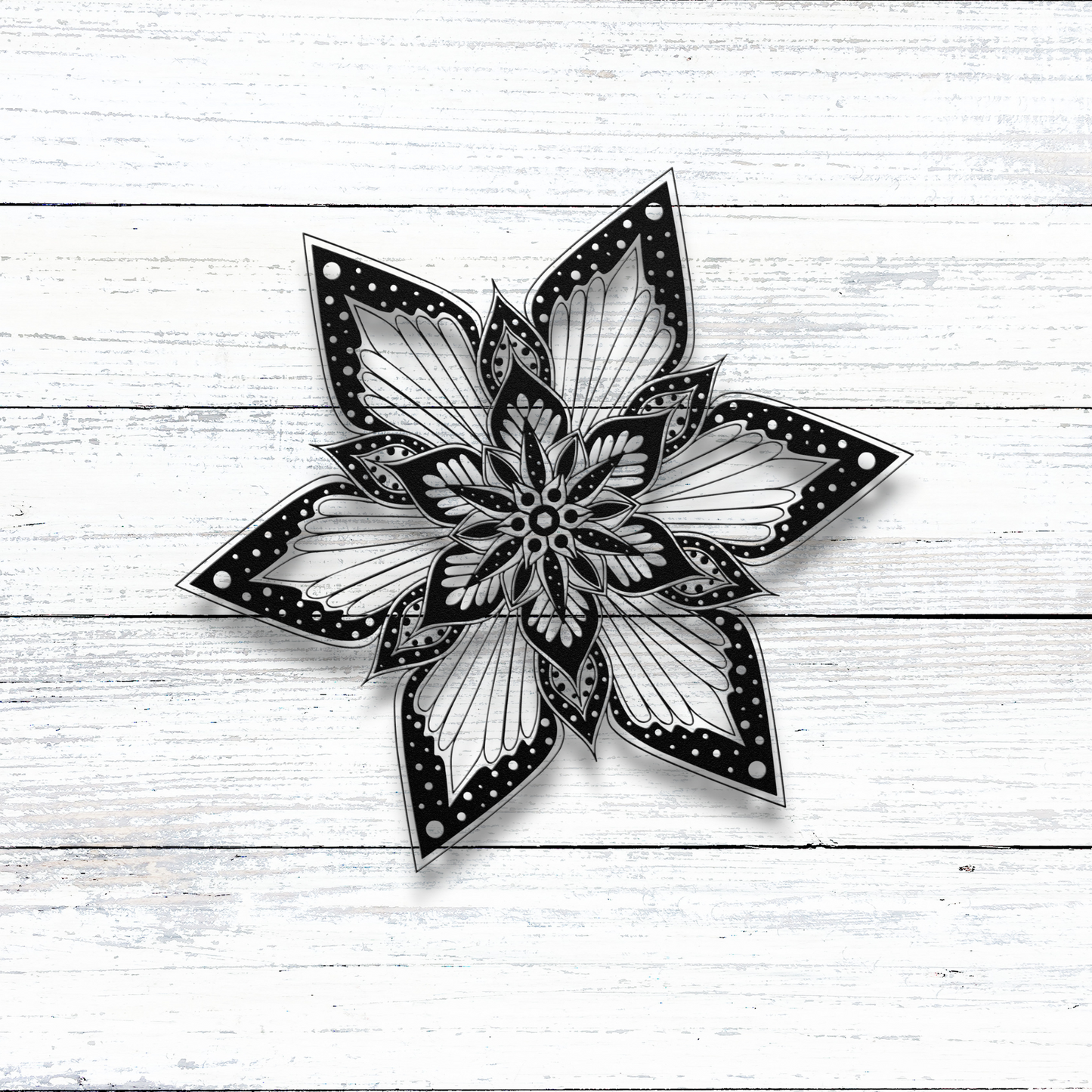 Starburst Flower Mandala Metal Wall Art on wood wall
