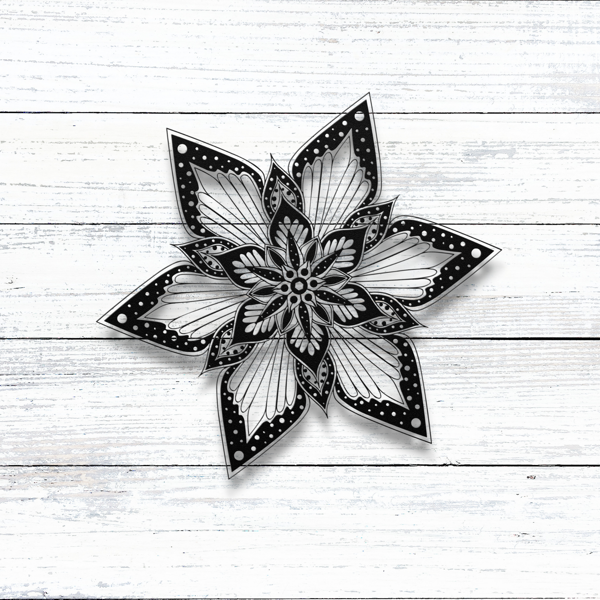 Starburst Flower Mandala Metal Wall Art on wood wall