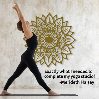 Woman in a yoga pose with a gold mandala wall decal and Merideth Halsey quote.