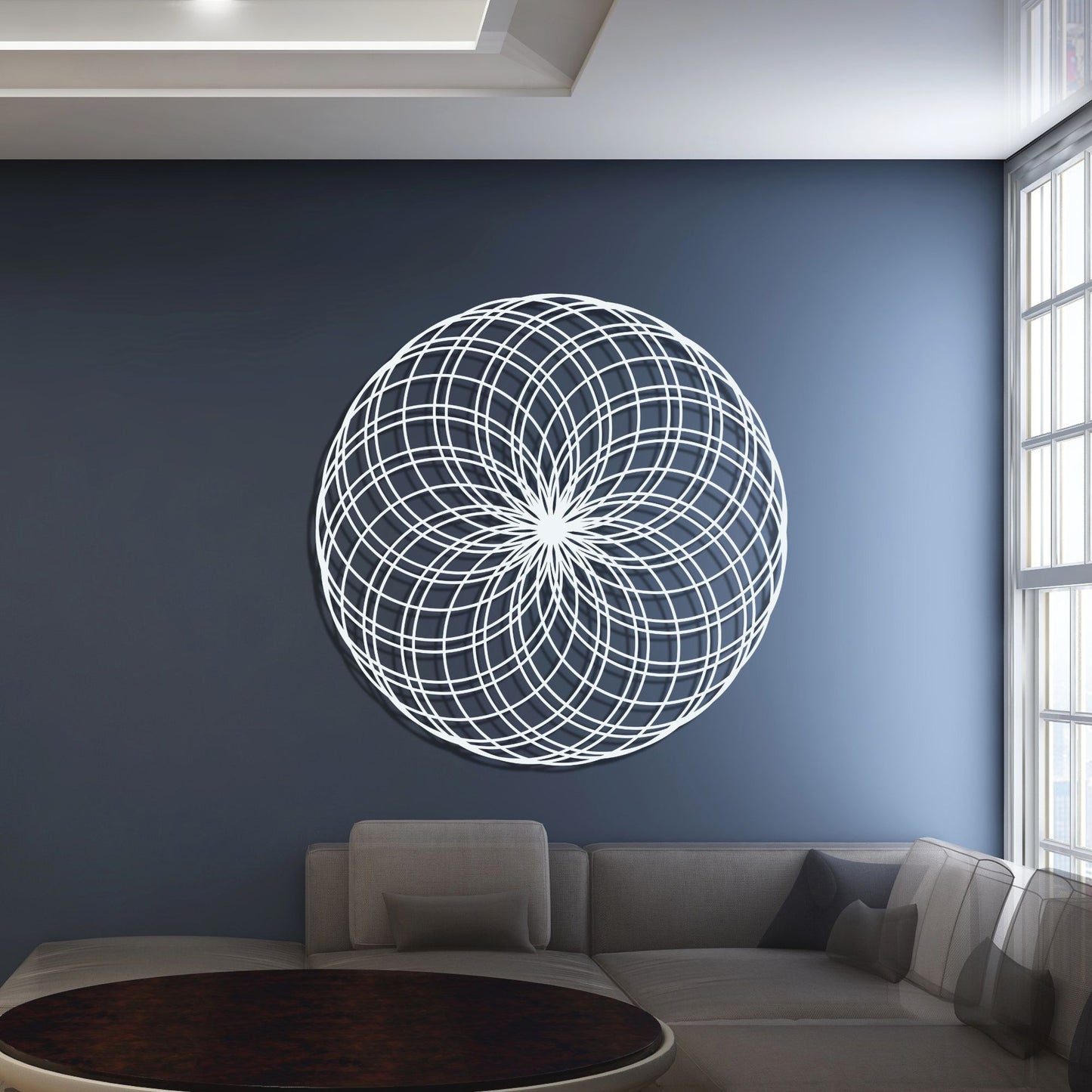 Decorative circular wall art on a blue wall in a living room.