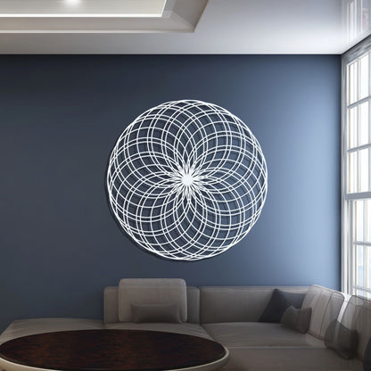 Decorative circular wall art on a blue wall in a living room.
