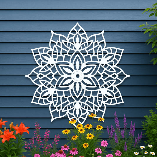 Decorative white mandala wall art on a blue wooden panel background with flowers in the foreground.