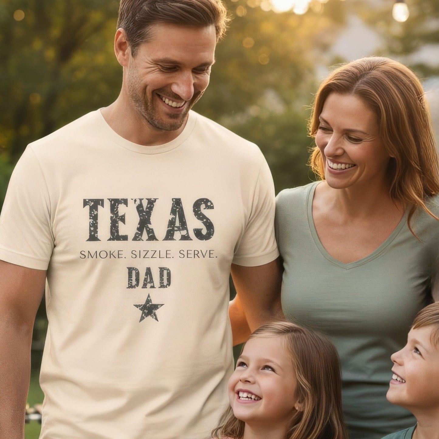 Man wearing a 'Texas Dad' t-shirt with a family outdoors.