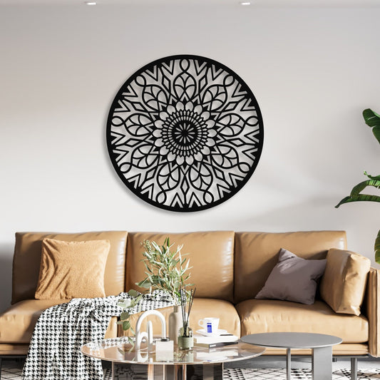 Decorative black and white wall art above a brown sofa in a living room.