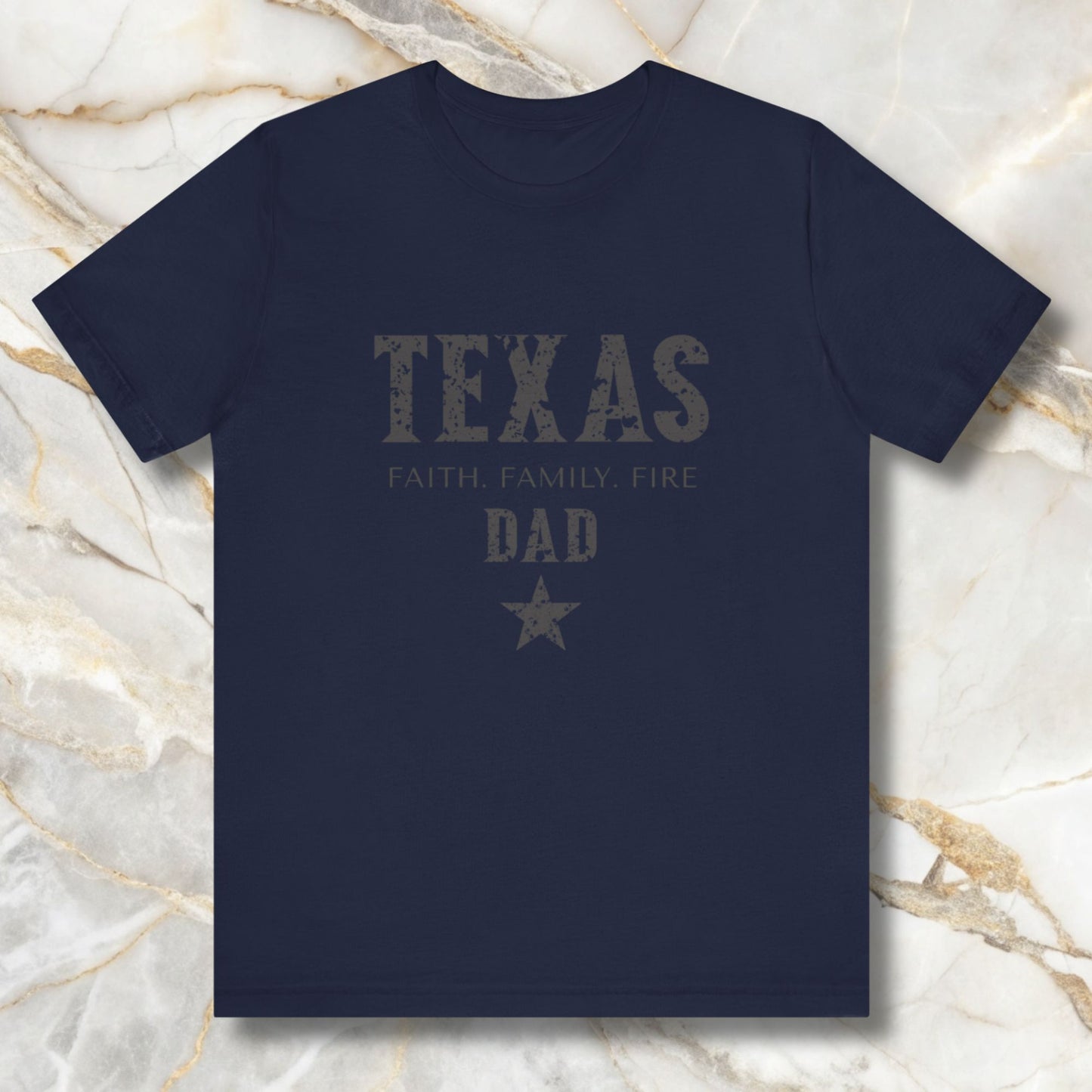 Navy blue t-shirt with 'TEXAS FAITH FAMILY FIRE DAD' text on a marble background