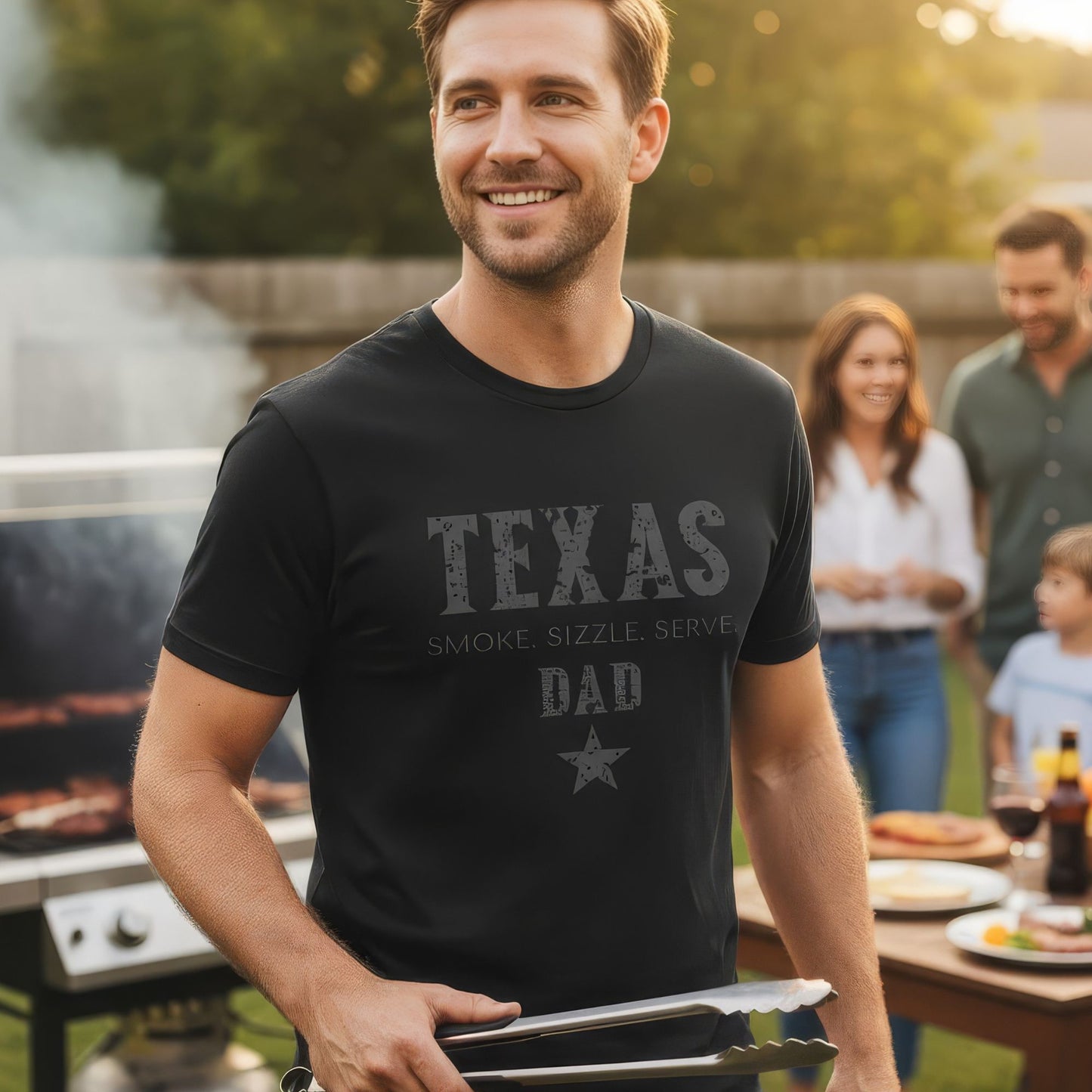 Man wearing a 'Texas Dad' t-shirt at a barbecue with family in the background