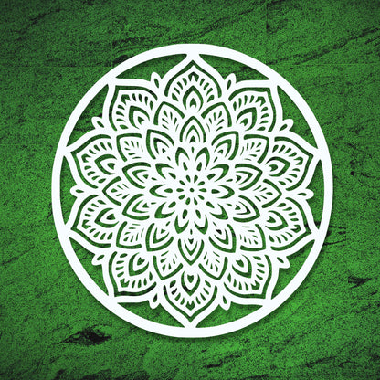 White mandala design on a green textured background