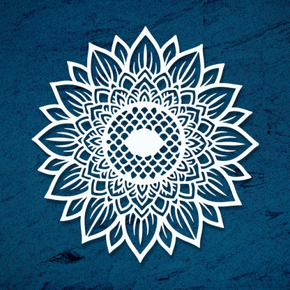 White floral mandala design on a blue textured background