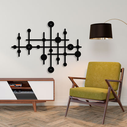 Modern living room with a green chair, wooden cabinet, and decorative wall art.