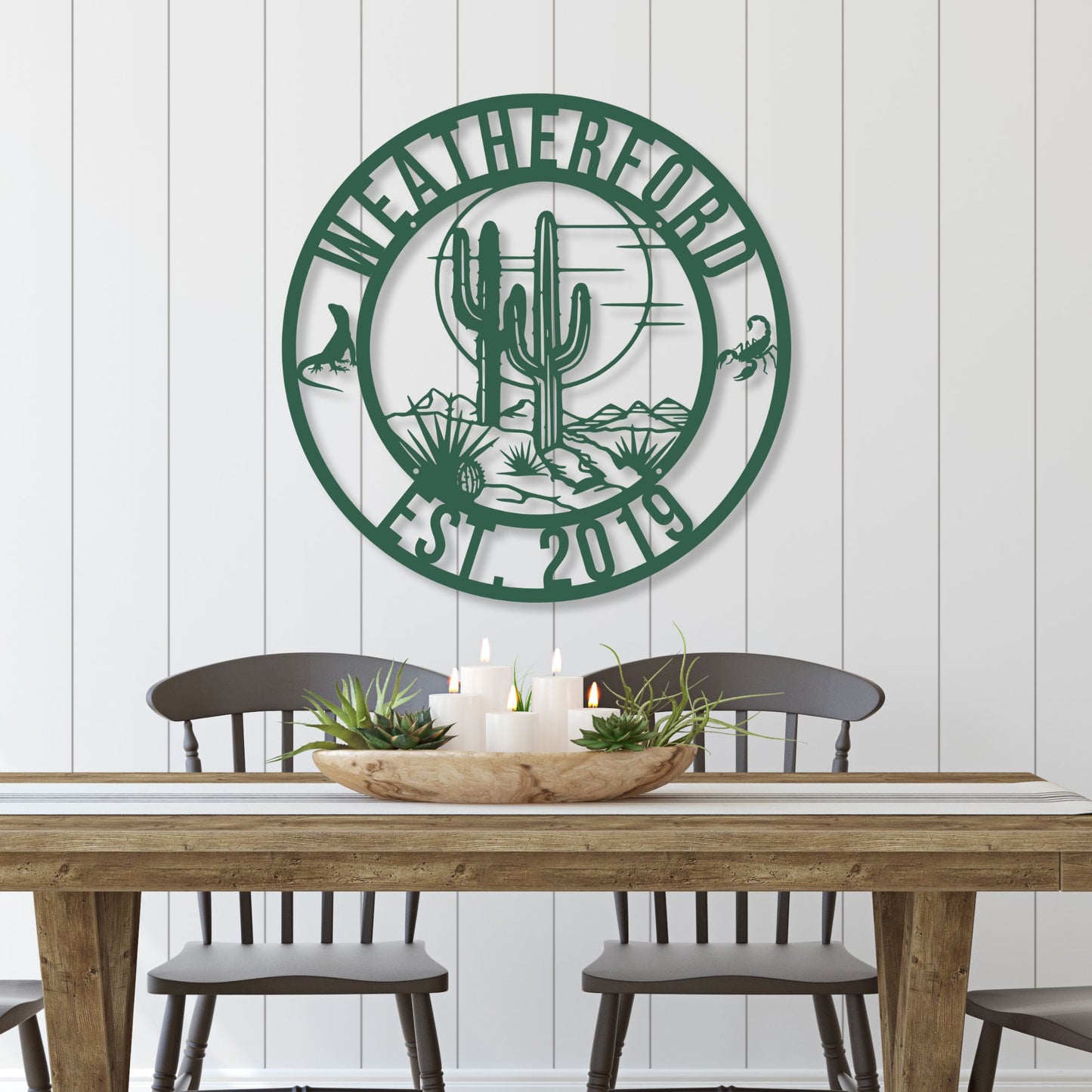 Decorative wall art with 'Weatherford' and cactus design above a dining table.