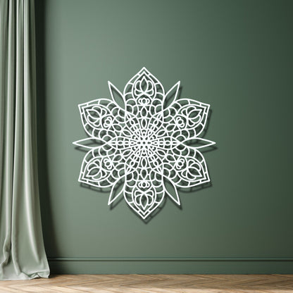Decorative white wall art on a green wall with a curtain and wooden floor.