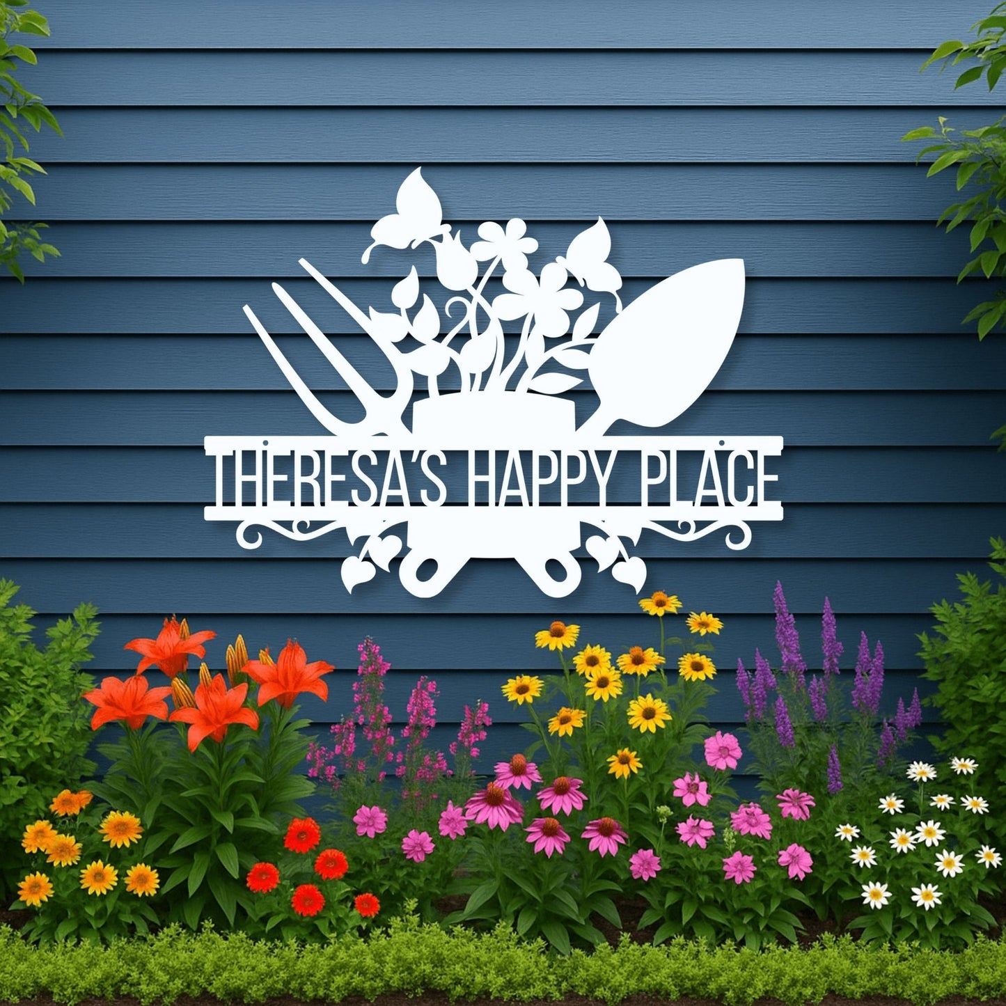 Decorative sign with 'Theresa's Happy Place' on a blue wall with garden flowers below.