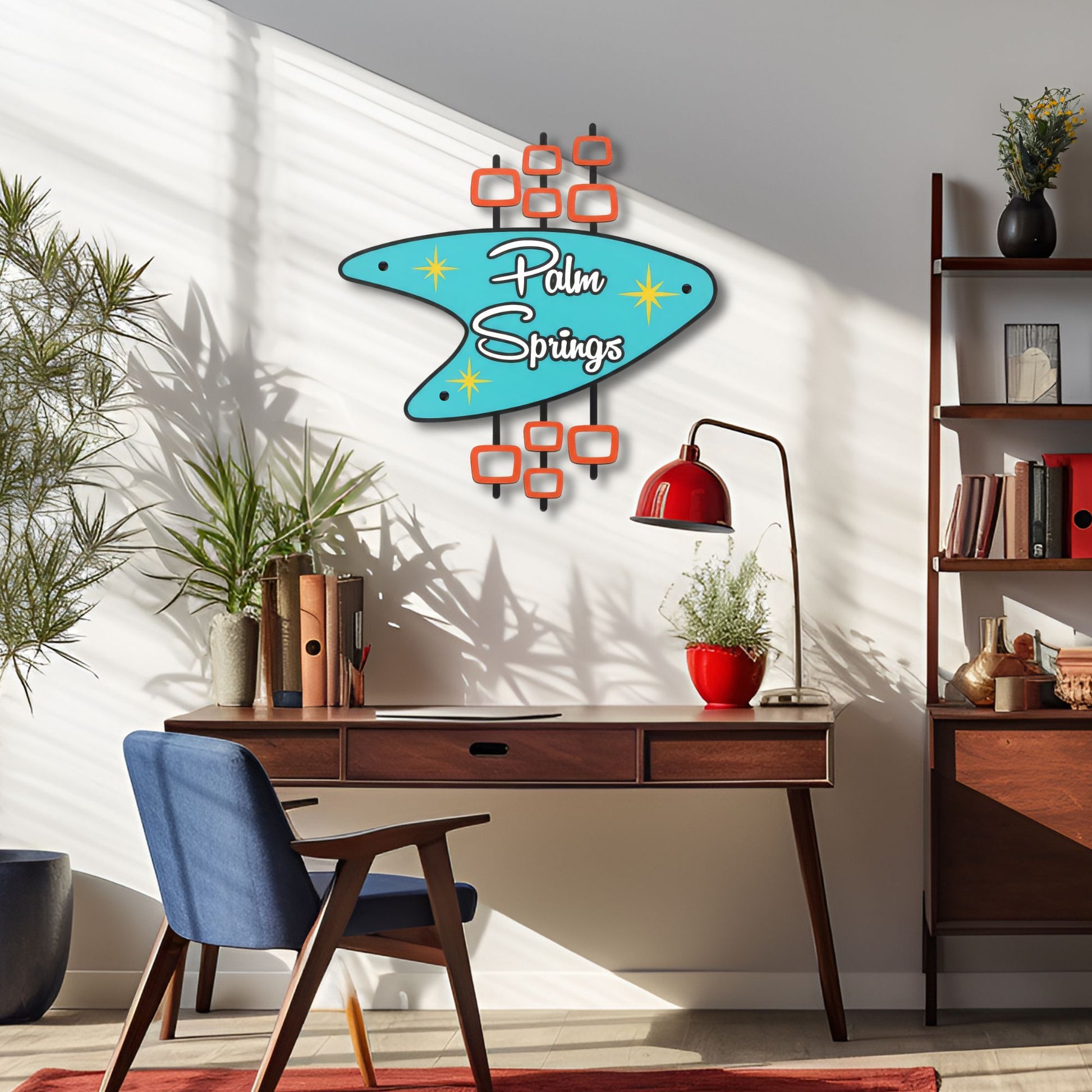 Modern office space with a 'Palm Springs' wall decoration, desk, and chair.