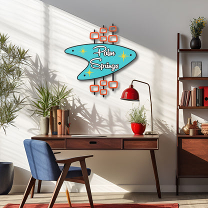 Modern office space with a 'Palm Springs' wall decoration, desk, and chair.