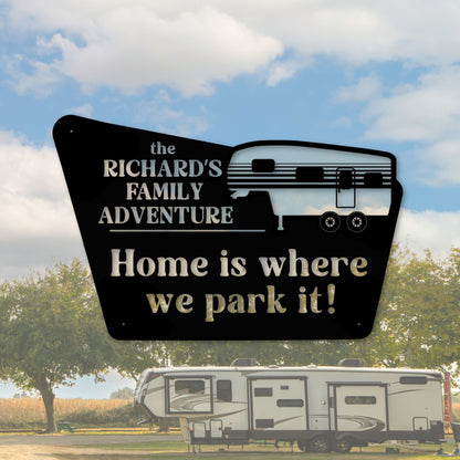 Decorative sign with 'the RICHARD'S FAMILY ADVENTURE' and 'Home is where we park it!' text, with an RV in the background.