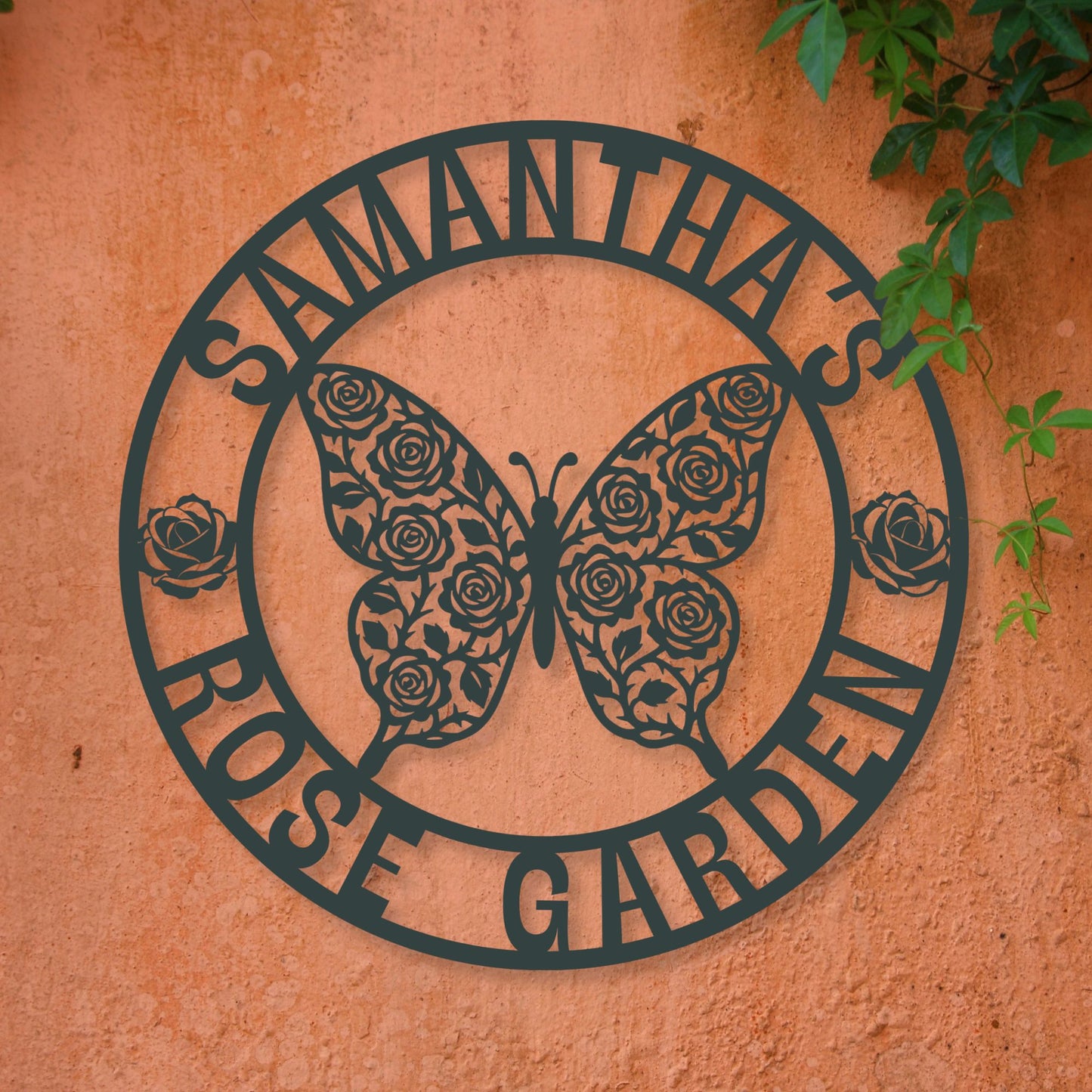 Decorative metal sign with butterfly and rose design on a textured wall.