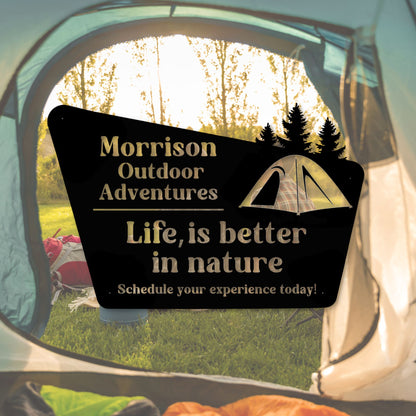 Camping-themed sign with 'Morrison Outdoor Adventures' and nature quote inside a tent.