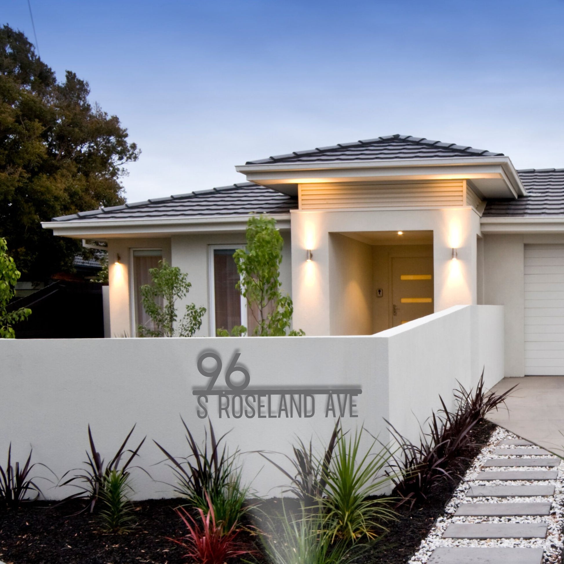 Modern house with '96 S Roseland Ave' address sign in a well-maintained garden.