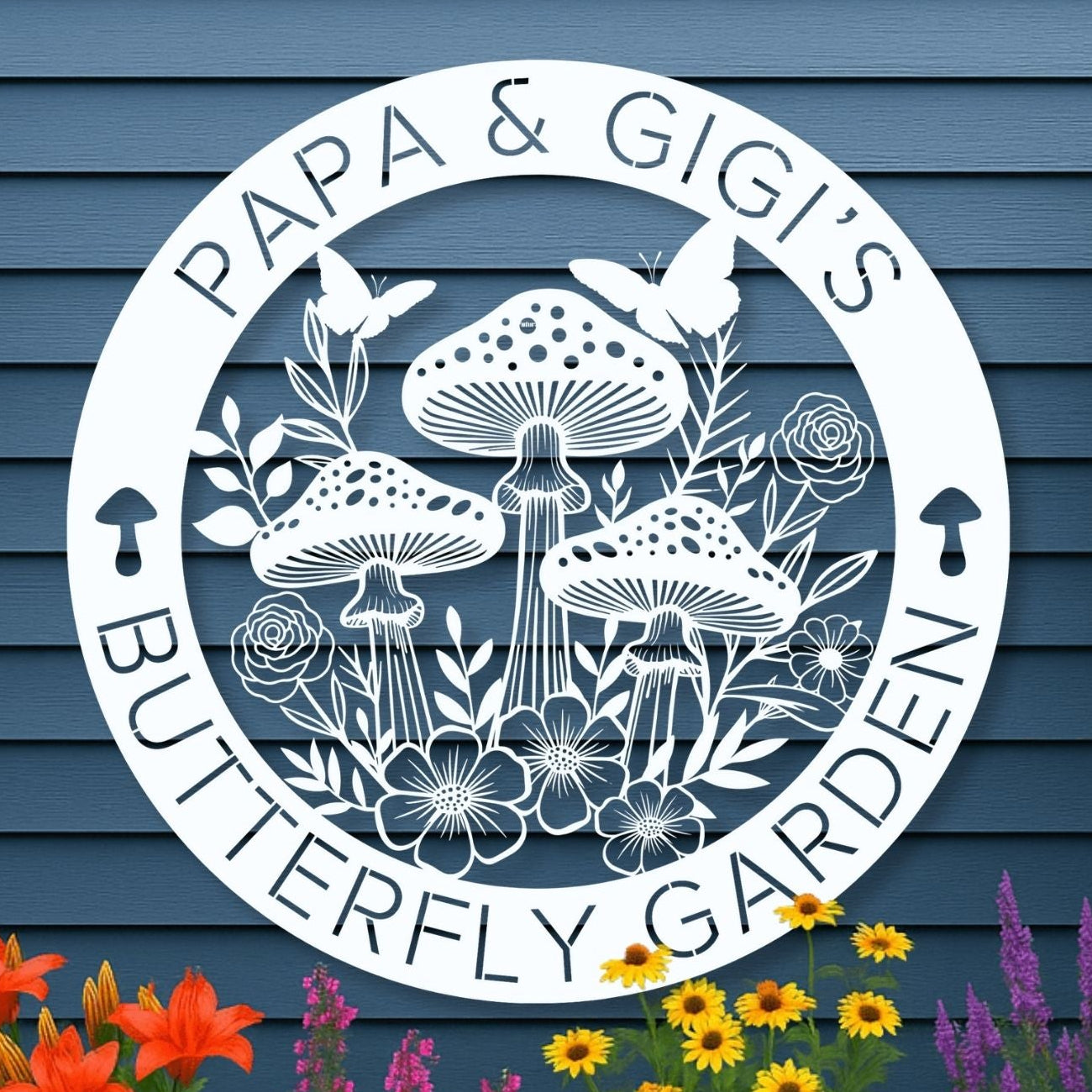 Decorative garden sign with 'Papa & Gigis Butterfly Garden' on a blue wall with flowers and plants.
