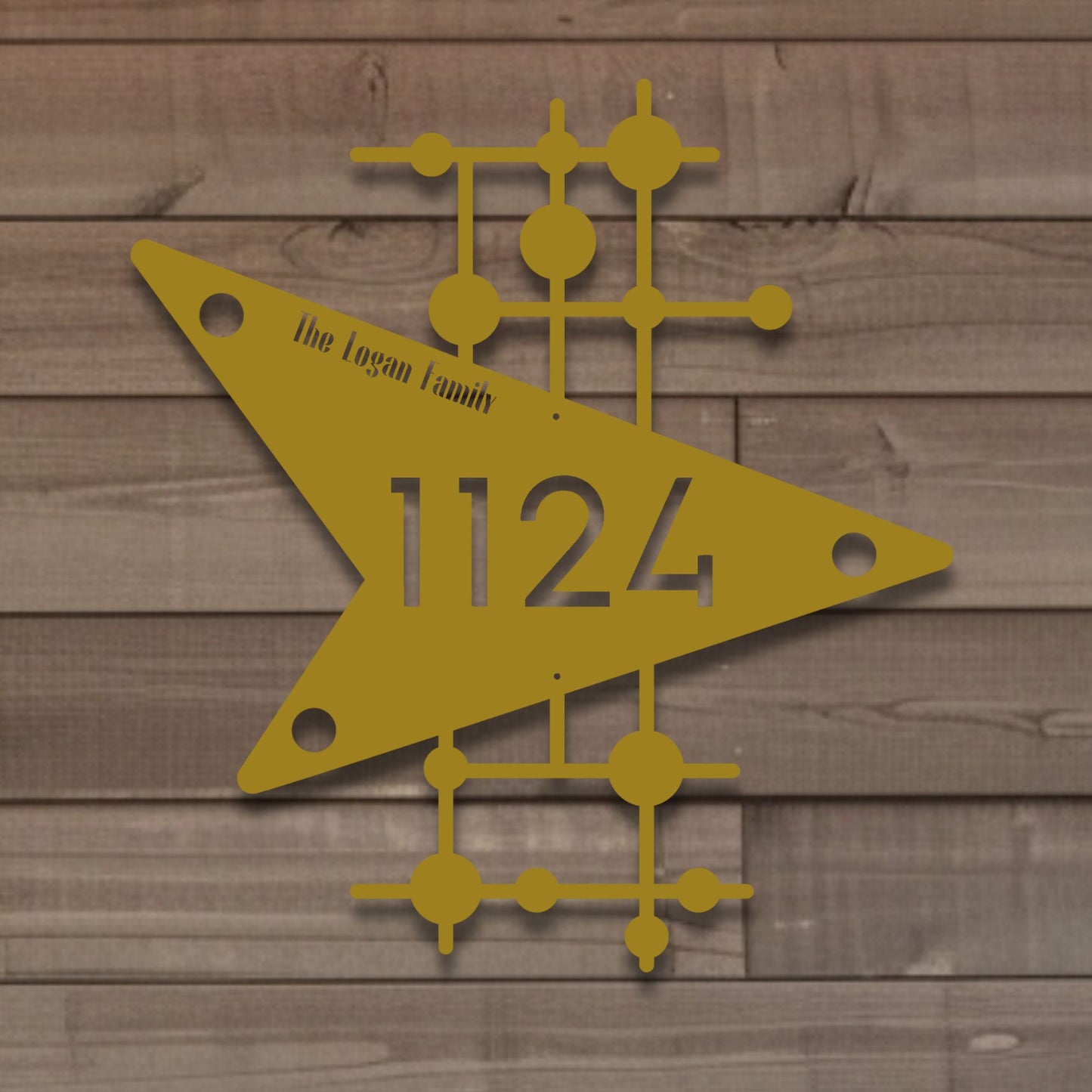 Decorative house number sign with geometric design on a wooden background