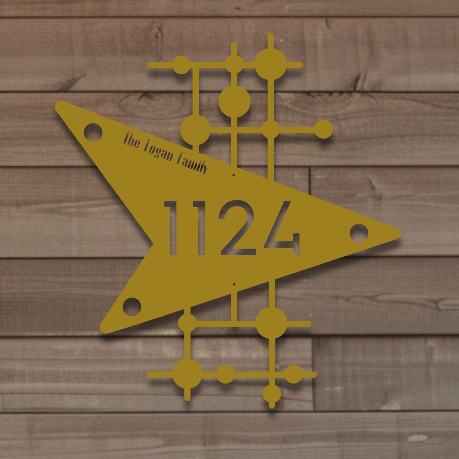 Decorative house number sign with geometric design on a wooden background