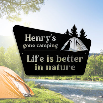 Personalized camping sign with a scenic background of a river and trees.