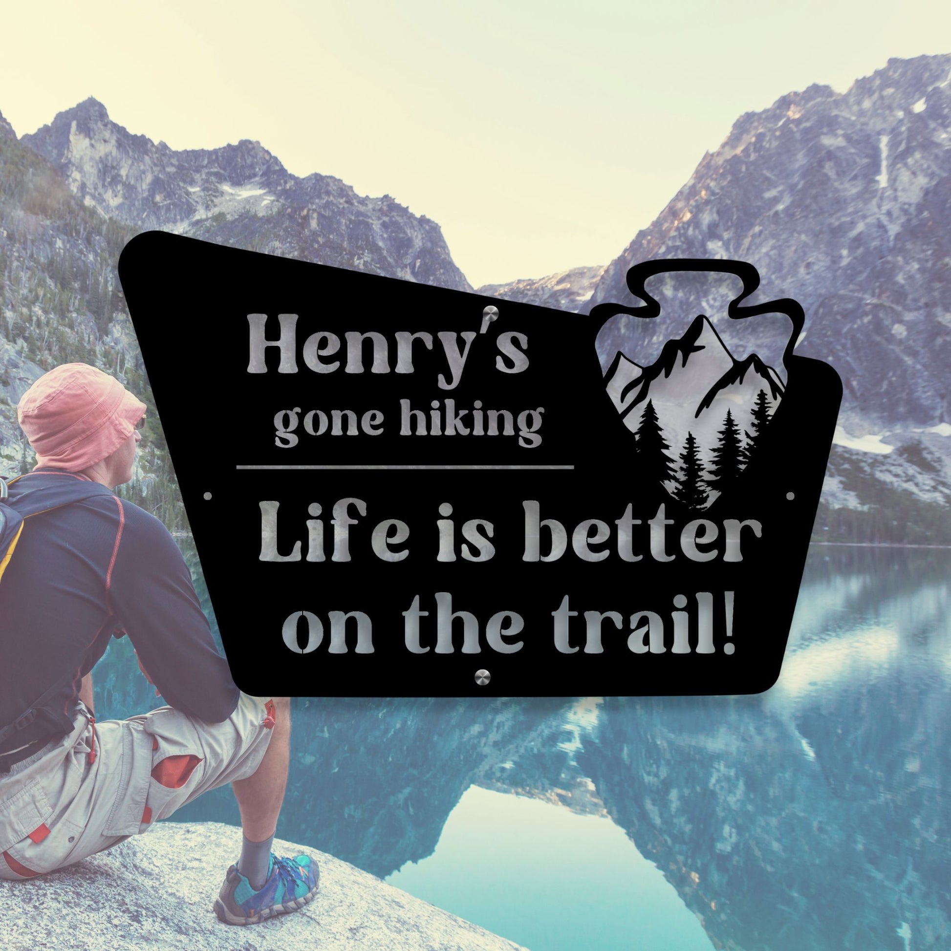 Person sitting on a rock with mountains in the background, wearing a hat and backpack, with a sign reading 'Henry's gone hiking Life is better on the trail!' overlayed.